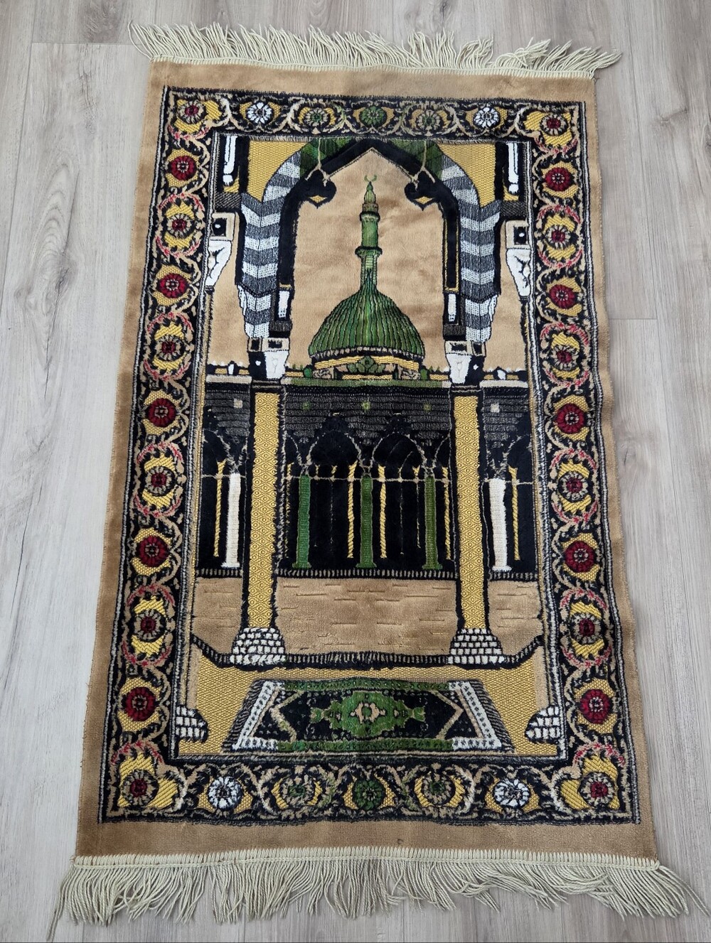 Islamic prayer rug with mosque and minaret design